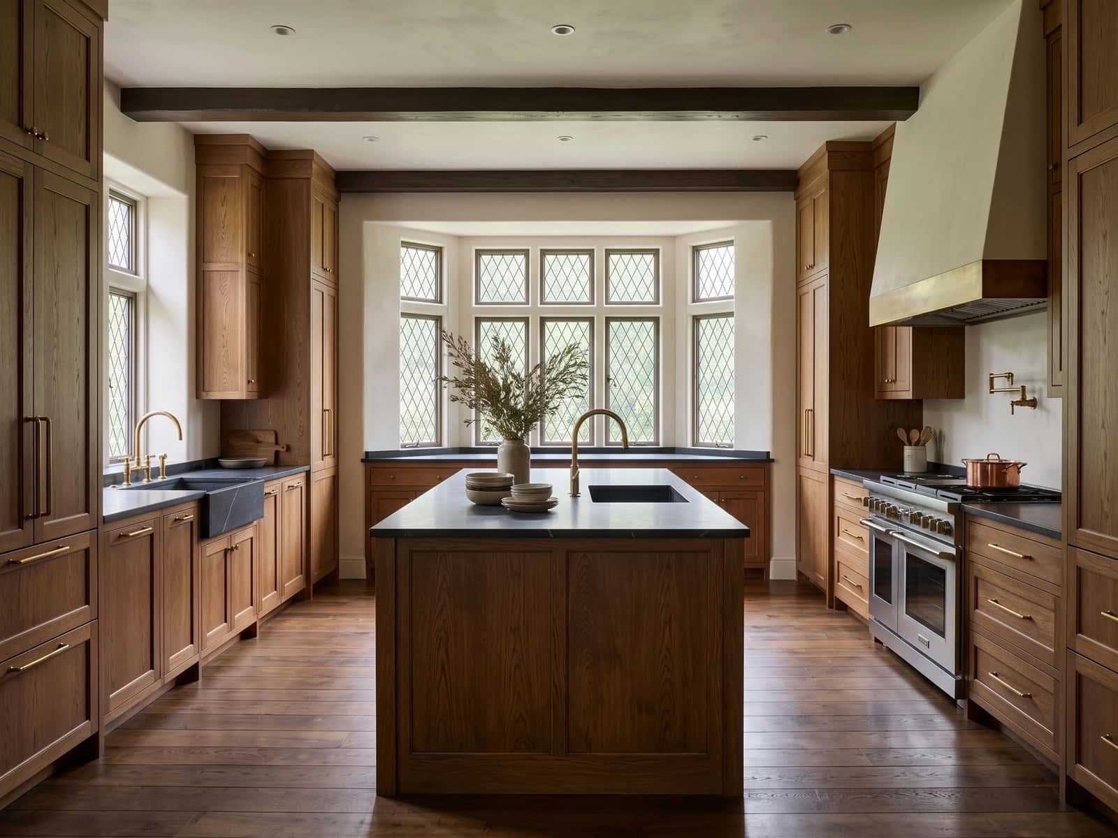 Expanded kitchen in oak, soapstone, and aged brass