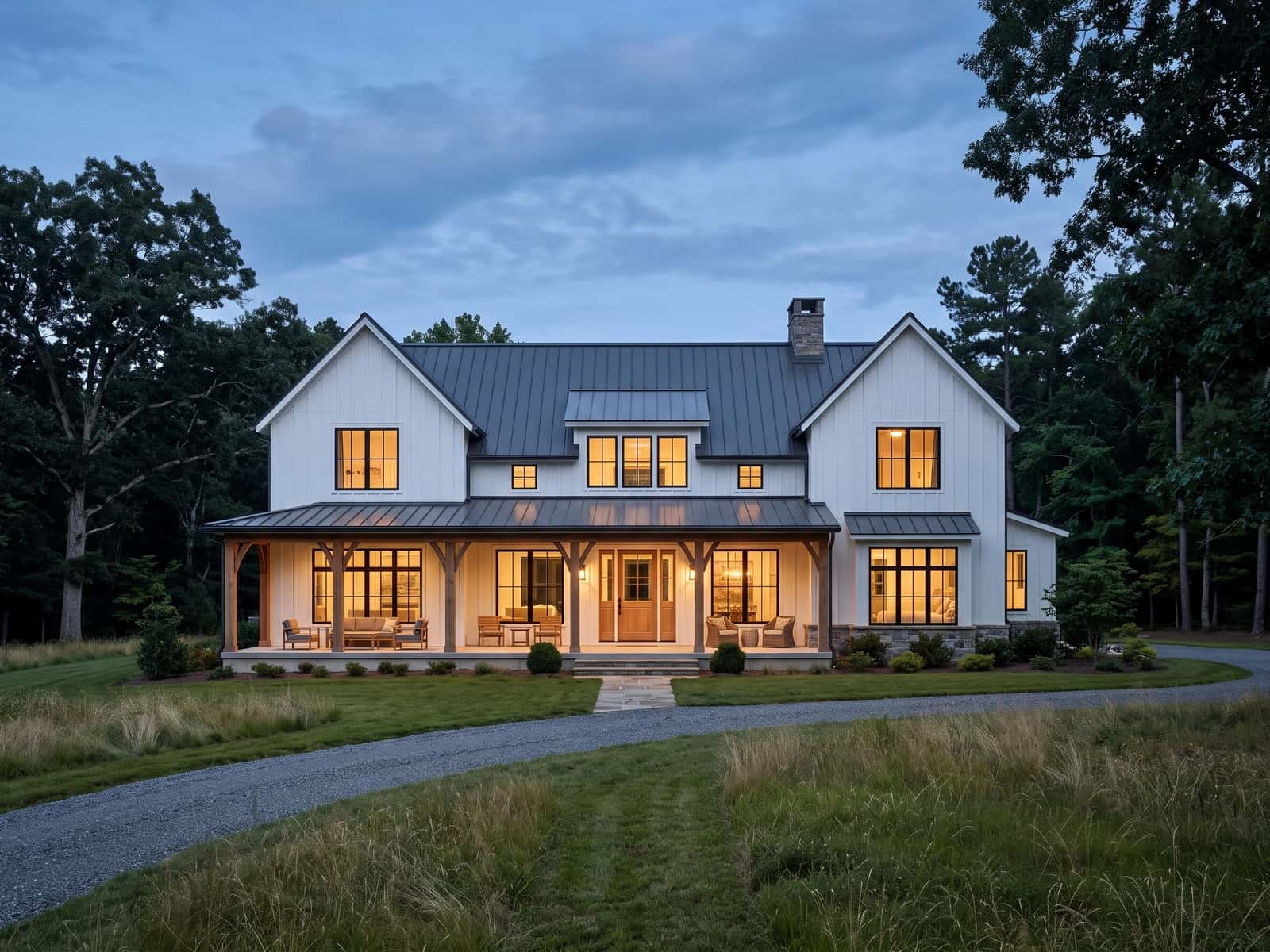 Modern farmhouse set between meadow and mature oaks